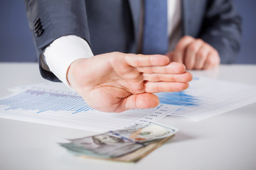 Businessman refusing money