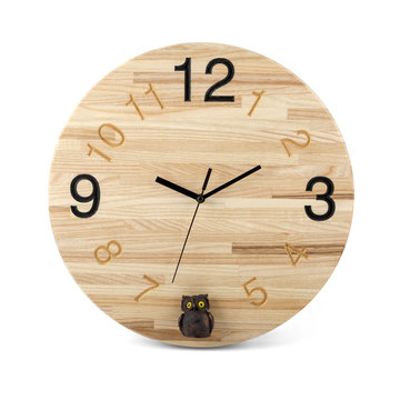 Wooden round wall watch with owl toy - clock isolated on white b