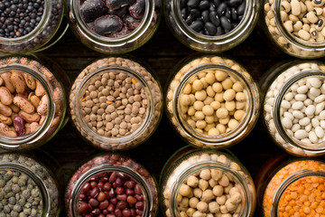 various dried legumes in jars