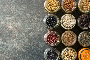 various dried legumes in jars