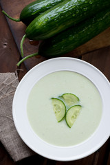 Close-up of cold cucumber cream-soup. Above view, studio shot