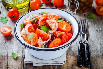 panzanella: Italian salad with tomatoes, ciabatta, olives, red onion and basil