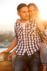 young couple in love at sunset
