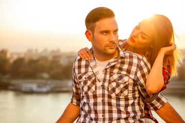 young couple in love at sunset