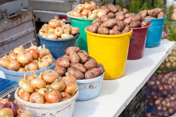 Fresh potatoes and onion of new harvest ready to sale at the loc