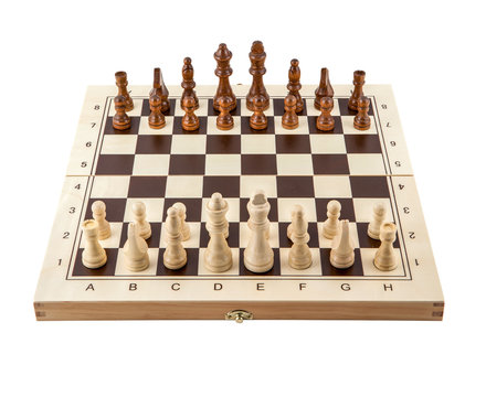 Chess board with chess wooden pieces isolated on white
