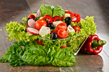 Vegetable salad bowl on kitchen table. Balanced diet