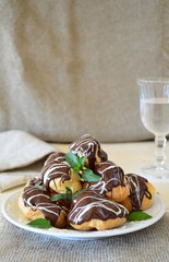 Profiteroles with dark and white chocolate 