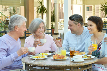 Happy family at breakfast