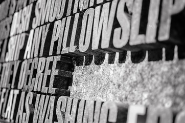 Obraz premium Photography of thick stone letters background in perspective 
