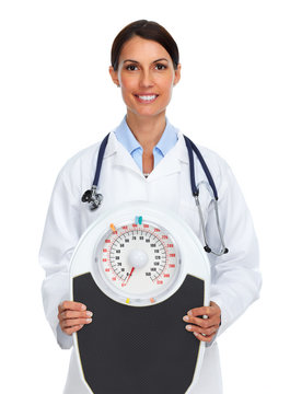 Young medical doctor woman with scales.