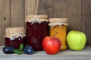 Jam jars and fresh fruits 
