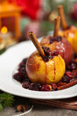 Baked Apples with Cinnamon. Christmas composition. Selective focus.