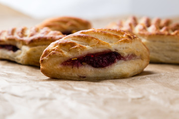 puff pastry with jam on paper