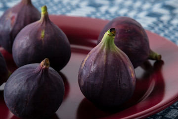 figs on a red plate