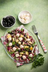 mixed salad with pineapple  mozzarella arugula and chicory