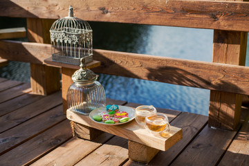 Tea with color figure biscuits on the outdoor veranda