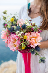 girl with a wedding bouquet boho style