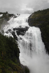 Waterfall in Husedalen valley in Hardangervidda national park, Norway