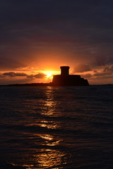 Rocco Tower, Jersey, U.K.  19th century Napoleonic Martello tower at the bay of St.Ouen at sunset.