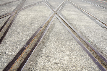 Background with railway crossing on gray asphalt