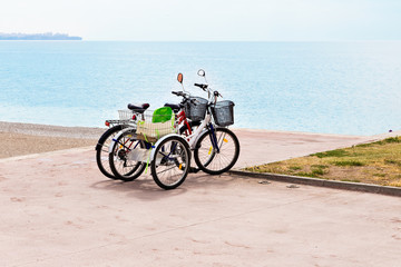 Fototapeta premium Two attached bicycles on the coast