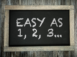 Easy As 1,2,3... written on chalkboard