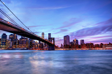 Brookyln bridge and Manhattan skyline at blue hour time.
