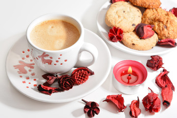 Christmas cup of coffee with cookies and red candle