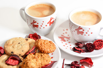 Two Christmas  cups of coffee and cookies