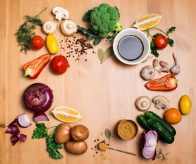 Colorful salad ingredients on wooden background with copyspace.
