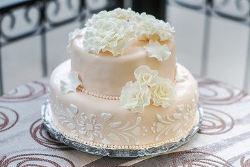 Beautiful light pink and tasty wedding cake