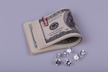 Hundred dollar bills and diamonds.