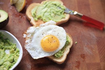 Toast with mashed avocado and fried egg 