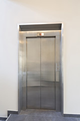 Closed elevator door in hotel lobby