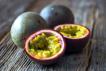 Passion fruits on wooden background
