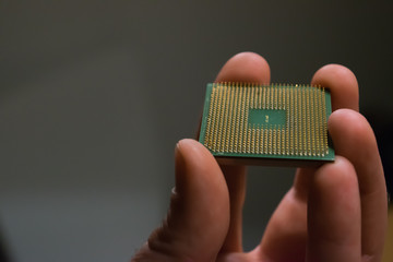 Hand holding an old processor
