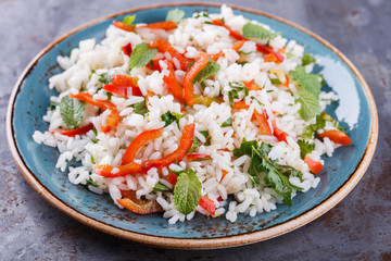 Salad with rice, sweet pepper, chili pepper and mint.selective focus