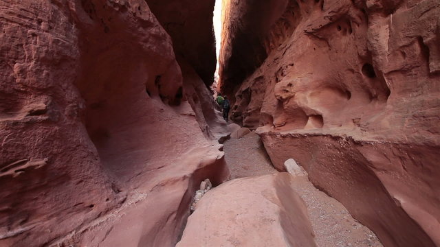 Couple hike climb out desert narrow slot canyon HD 1584