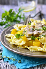 Farfalle with pumpkin in mushroom sauce.