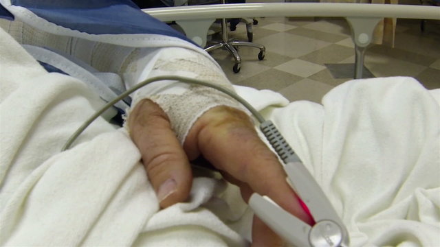 Patient's hand with oxygen sensor in hospital HD 001