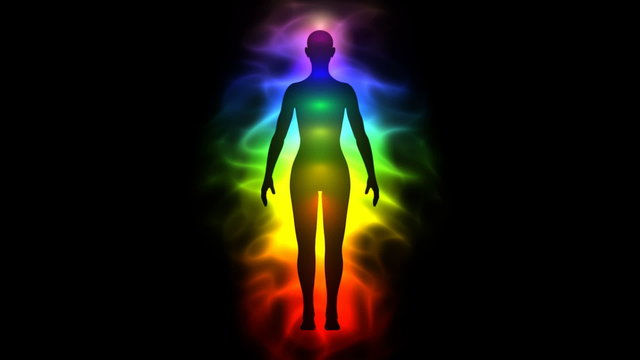 Aura and chakras - silhouette of woman