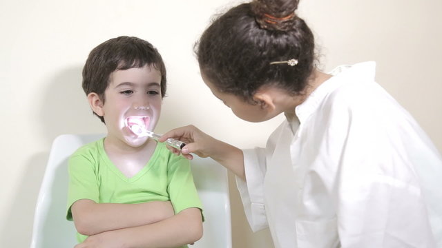 Kids role play patient at the dentist
