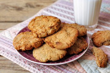 Homemade cookies and glass of milk on table close up