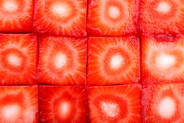 Fresh sliced strawberries cubes close up