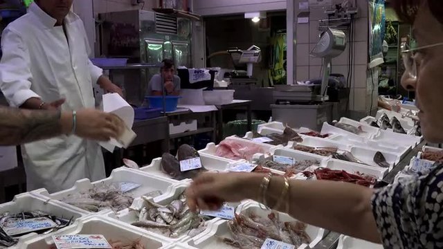 Rome Italy fresh seafood fish market paying money 4K 057