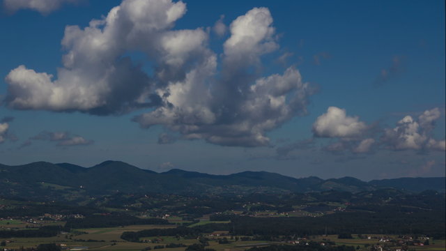 Time lapse of a Slovenian countryside valley with sunny and cloudy weather