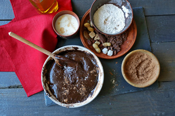Preparing dough for chocolate pie on table close up