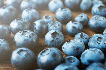 Fresh blueberries on wooden table, closeup