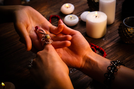 Witch - fortune teller reading fortune close up